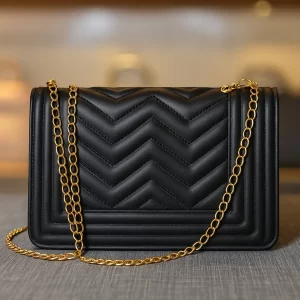 Black PU leather crossbody bag with gold chain by Vibe Totes