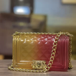 jelly crossbody bag with gold chain in yellow-to-red gradient, quilted texture, luxury women’s ladies bags for girls in pakistan front view.