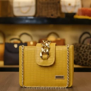 Yellow PU leather ladies crossbody bag with gold chain detail and crocodile texture front view – Vibe Totes