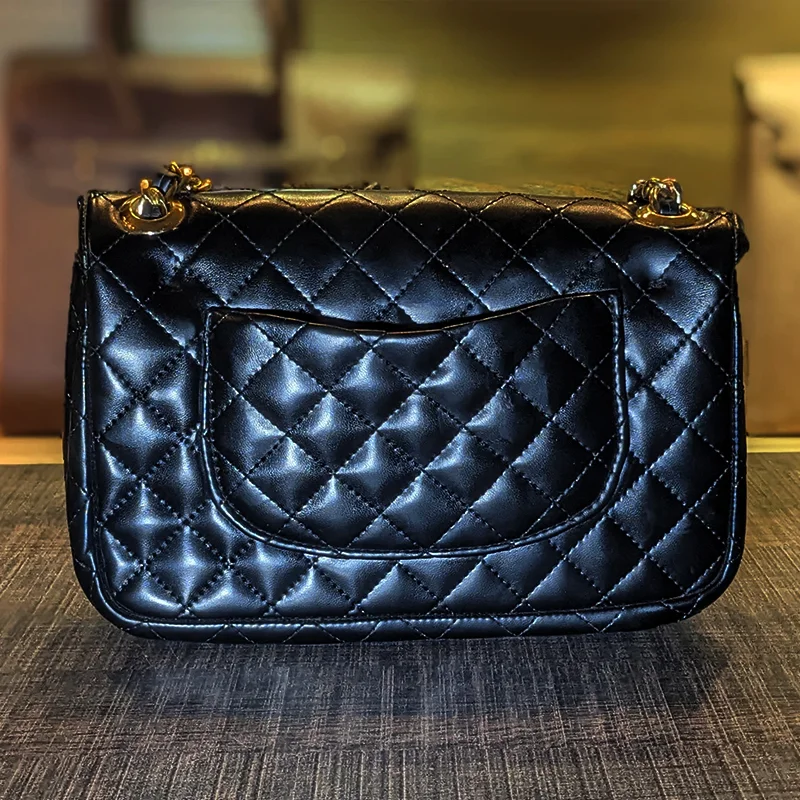 Back view of black quilted ladies shoulder bag with stitched pocket – Vibe Totes