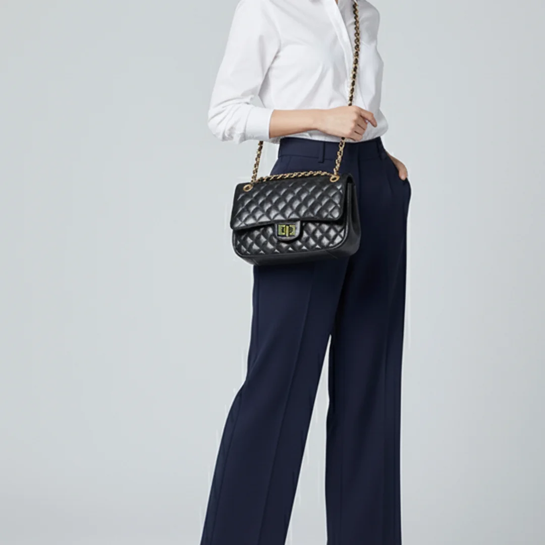 Woman carrying black quilted ladies crossbody and shoulder bag with gold chain – Vibe Totes