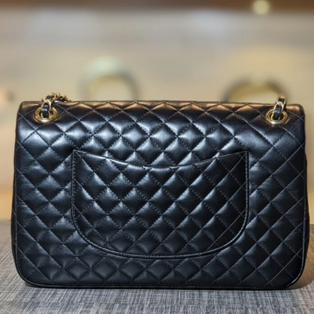 Black quilted ladies shoulder bag with gold chain – back view