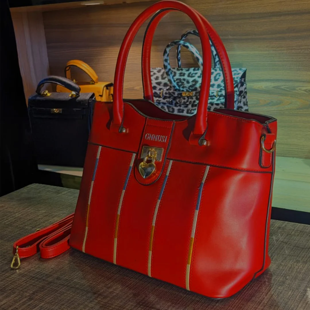 Front view of red ladies shoulder bag with top handles and heart lock – Vibe Totes Pakistan