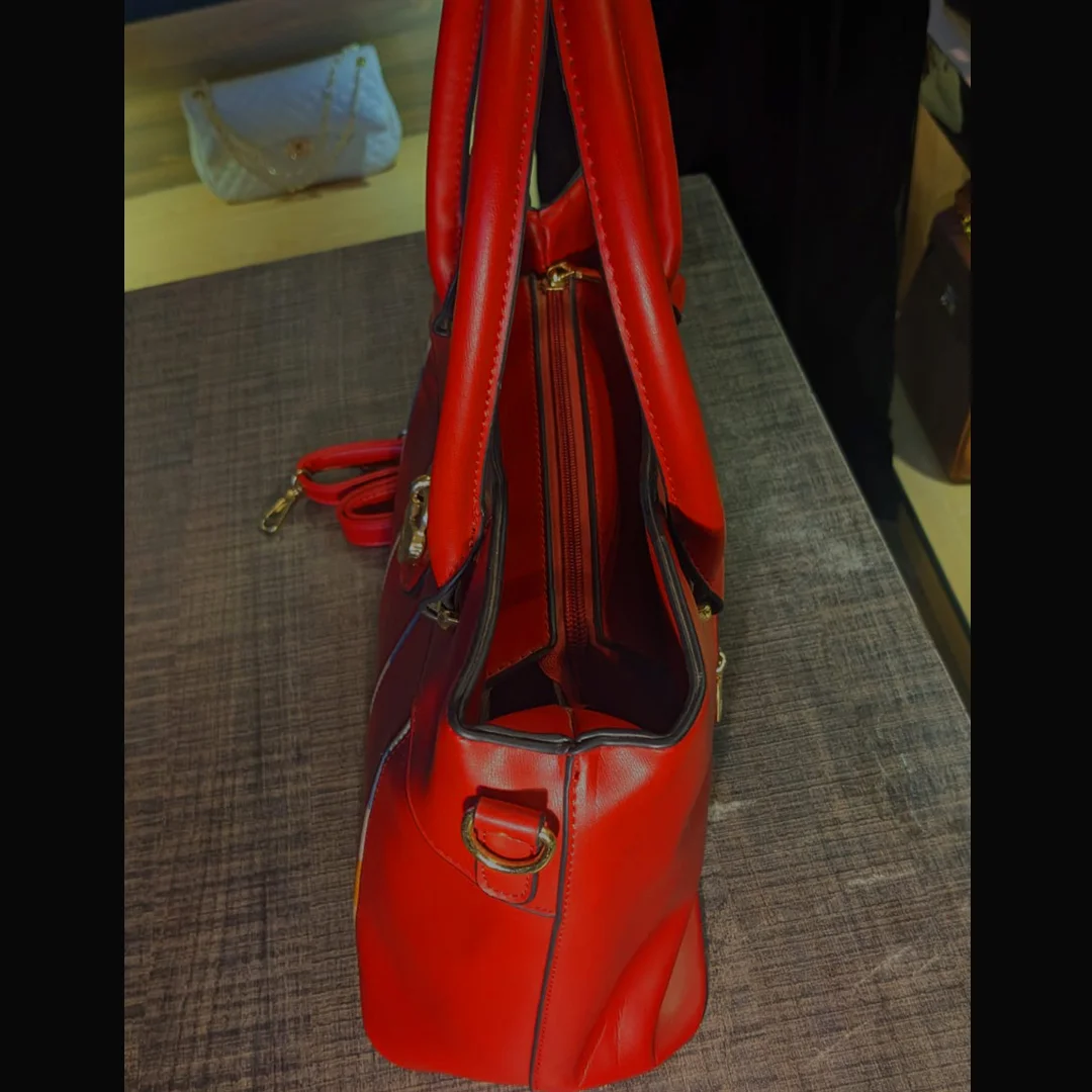 Side view of red shoulder handbag with structured design – Vibe Totes