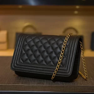 front view of Vibe Totes black quilted crossbody bag