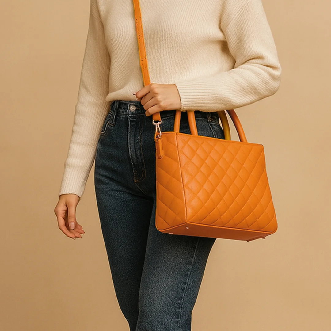 Woman carrying a mustard quilted shoulder bag from Vibe Totes