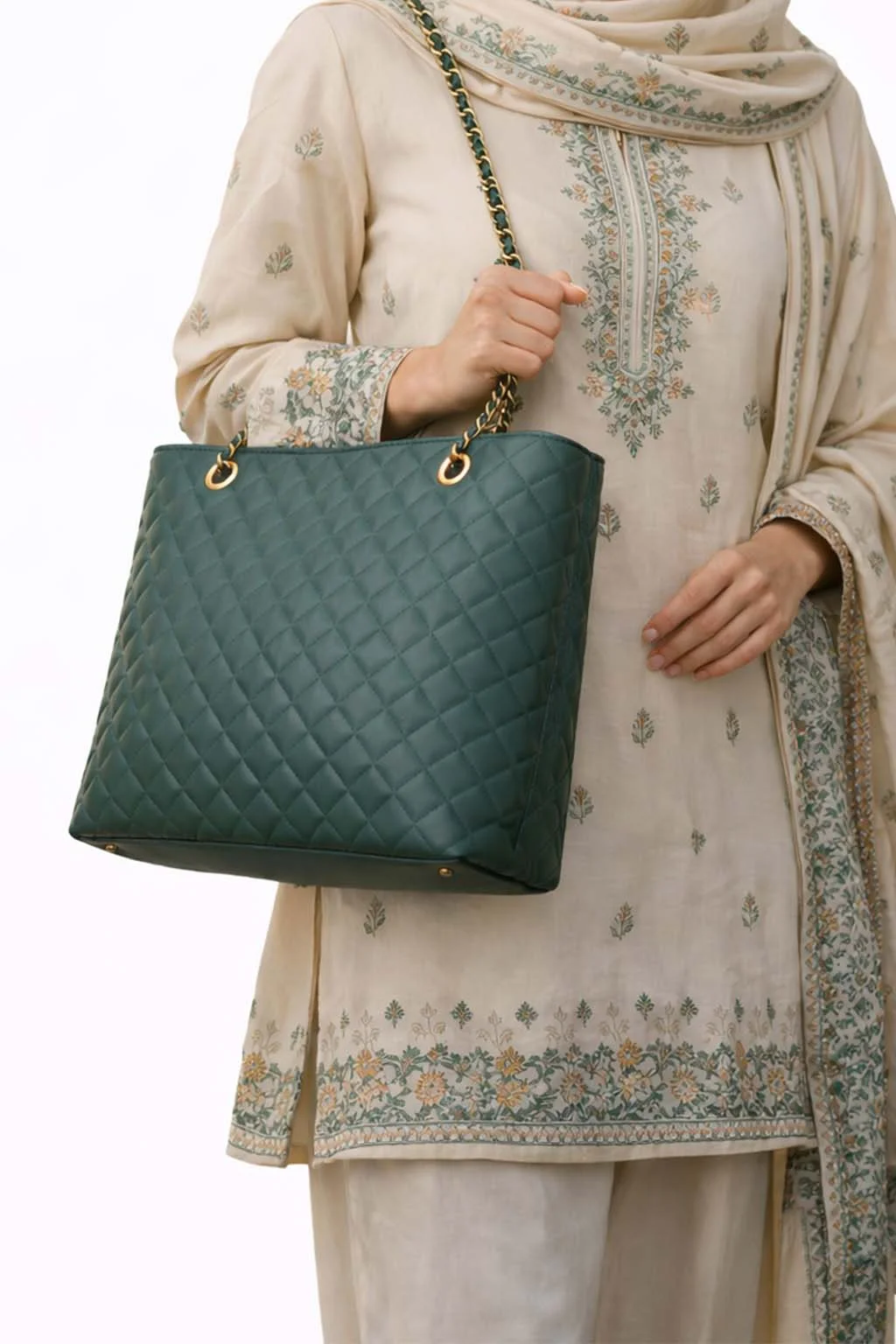 Model carrying deep green quilted tote bag for ladies, stylish women handbag by VibeTotes Pakistan