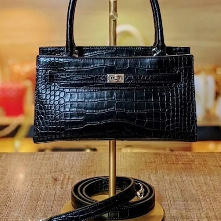 side view of Black crocodile-Leather latitude Shoulder bag with top handles from VibeTotes