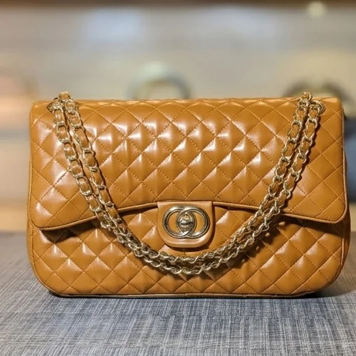 Brown quilted ladies shoulder bag with gold chain – front view