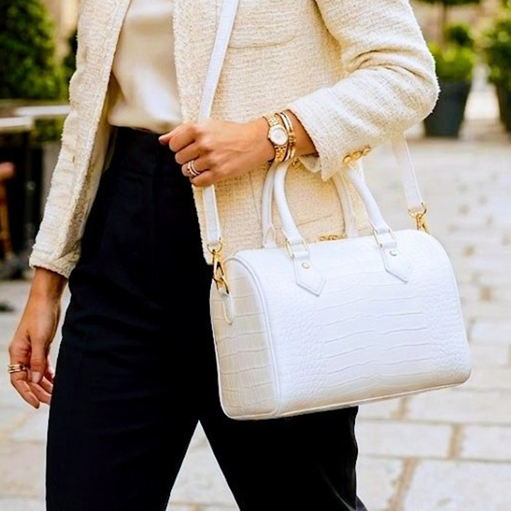Side view of white crocodile texture ladies crossbody duffle bag by Vibe Totes