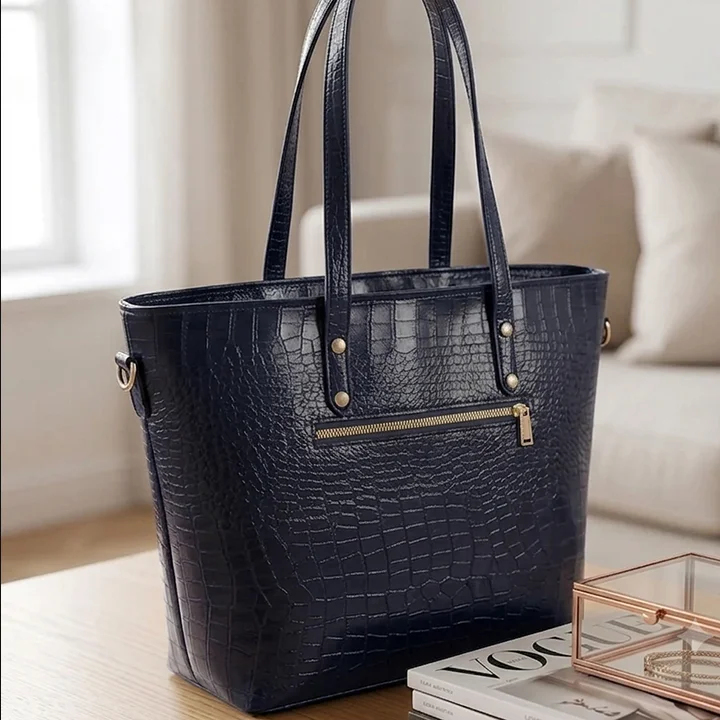 Back view of Vibe Totes blue crocodile leather shoulder bag featuring a secure horizontal zipper pocket