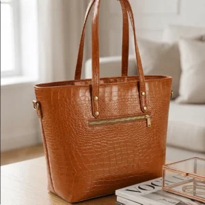 Back view of Vibe Totes brown crocodile leather shoulder bag featuring a secure horizontal zipper pocket