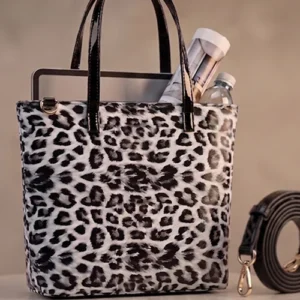 White snow leopard print tote bag by Vibe Totes - front view of a stylish ladies bag featuring black patent handles and a structured silhouette