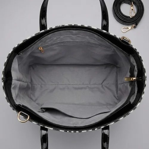 Inside view of the white snow leopard tote bag, showing a spacious grey fabric lining, a zipper pocket, and ample room for daily essentials.