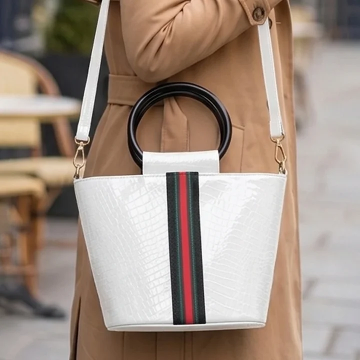 Model carrying the Vibe Totes white crocodile textured crossbody bag, a stylish and structured choice among everyday ladies bags.